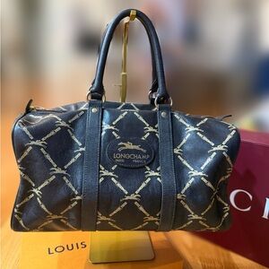 Longchamp Black Travel Bag with Gold Accents